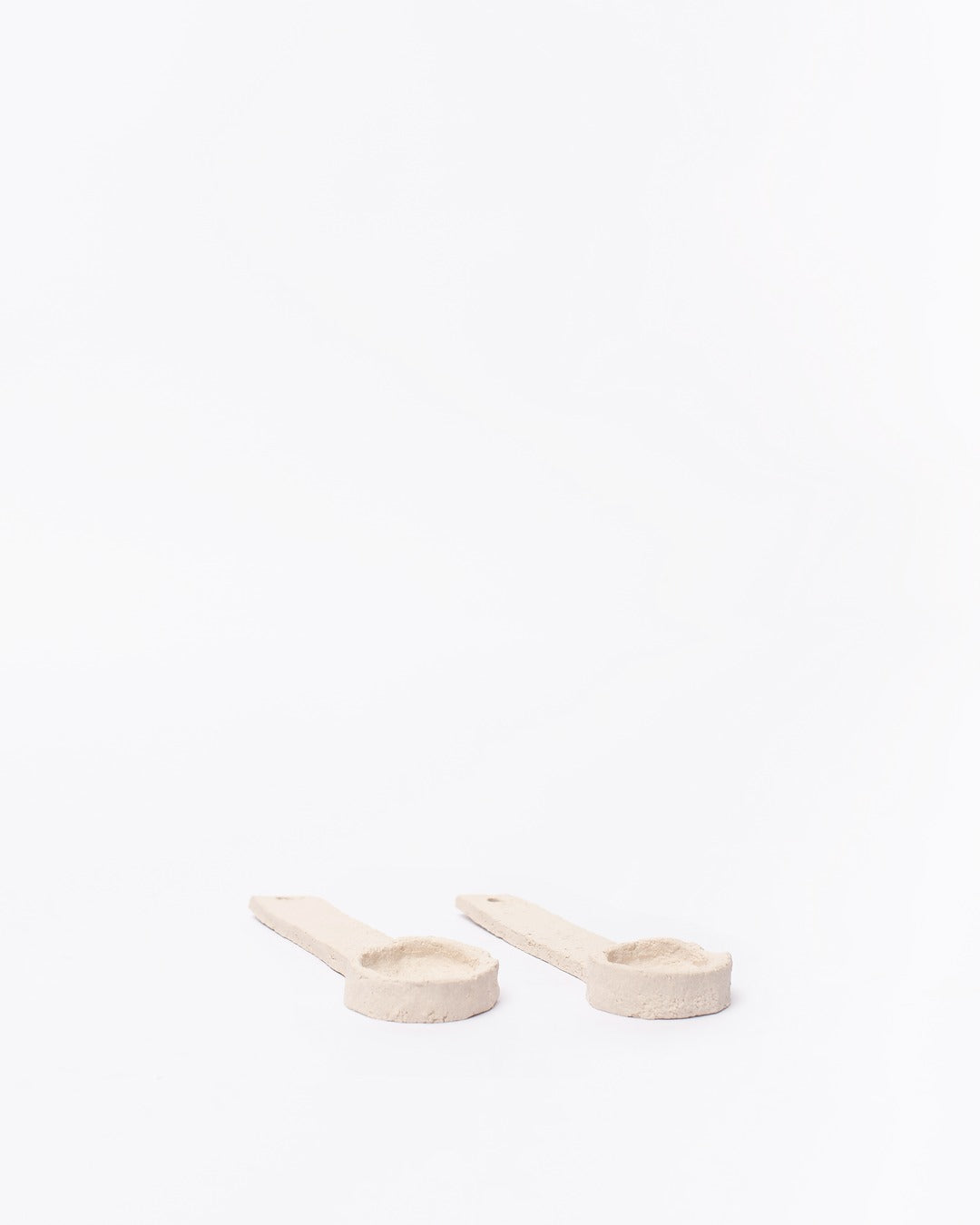 Set of ceramic spoons on a white background #2