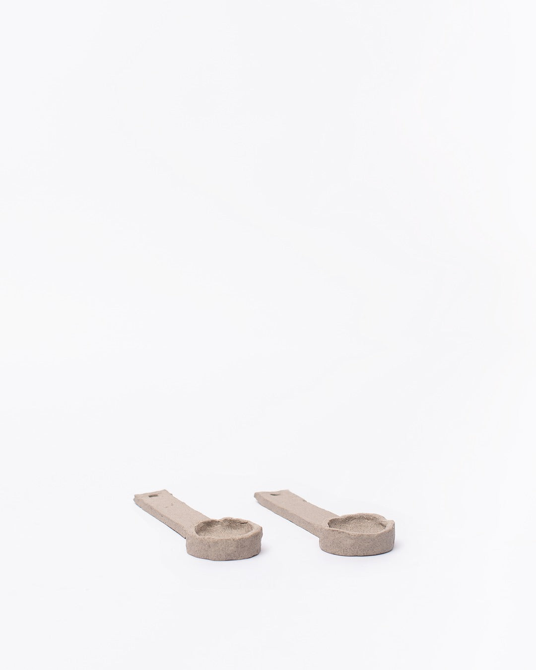 Set of ceramic spoons on a white background #3