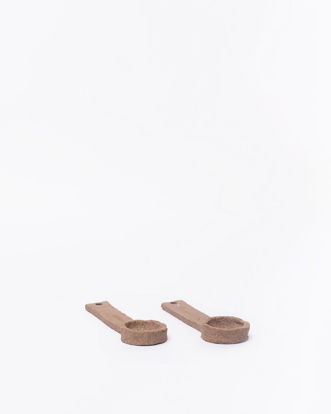 Set of ceramic spoons on a white background #4