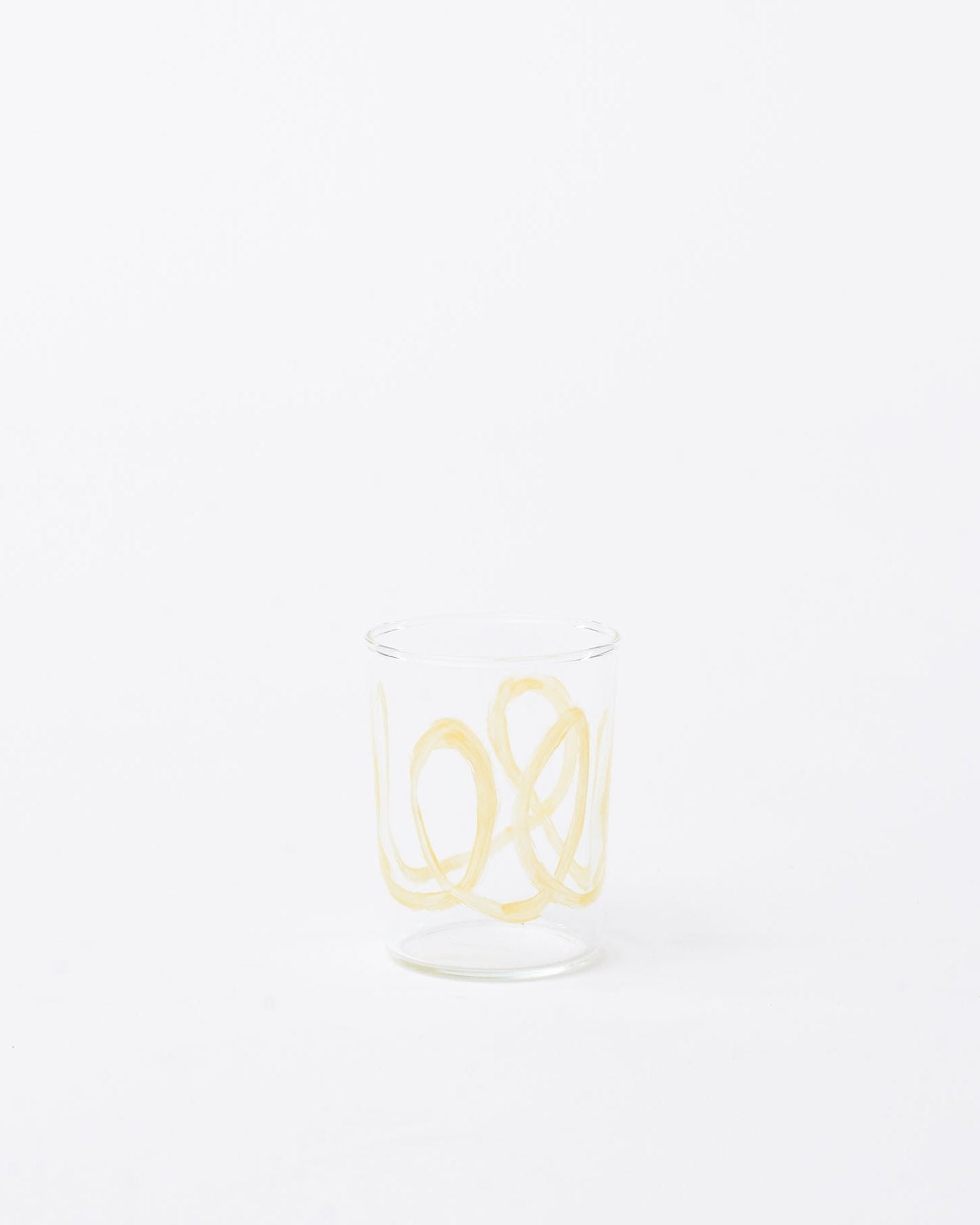 Glass yellow swirl design in white background 