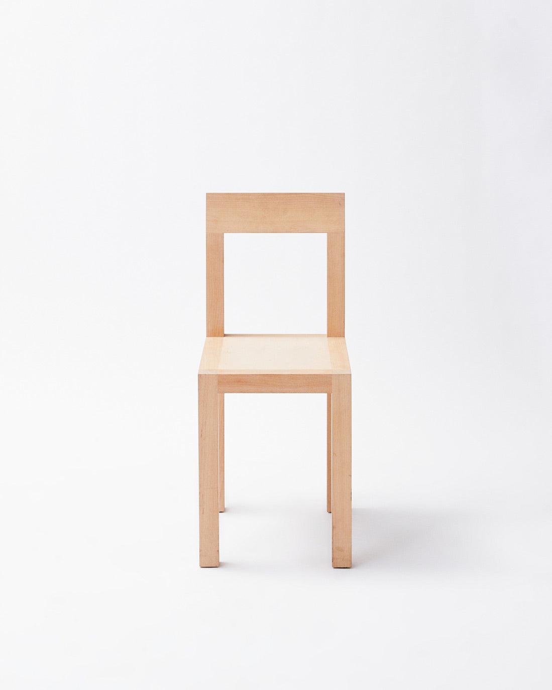 Handmade in denmark chair in front view on white background