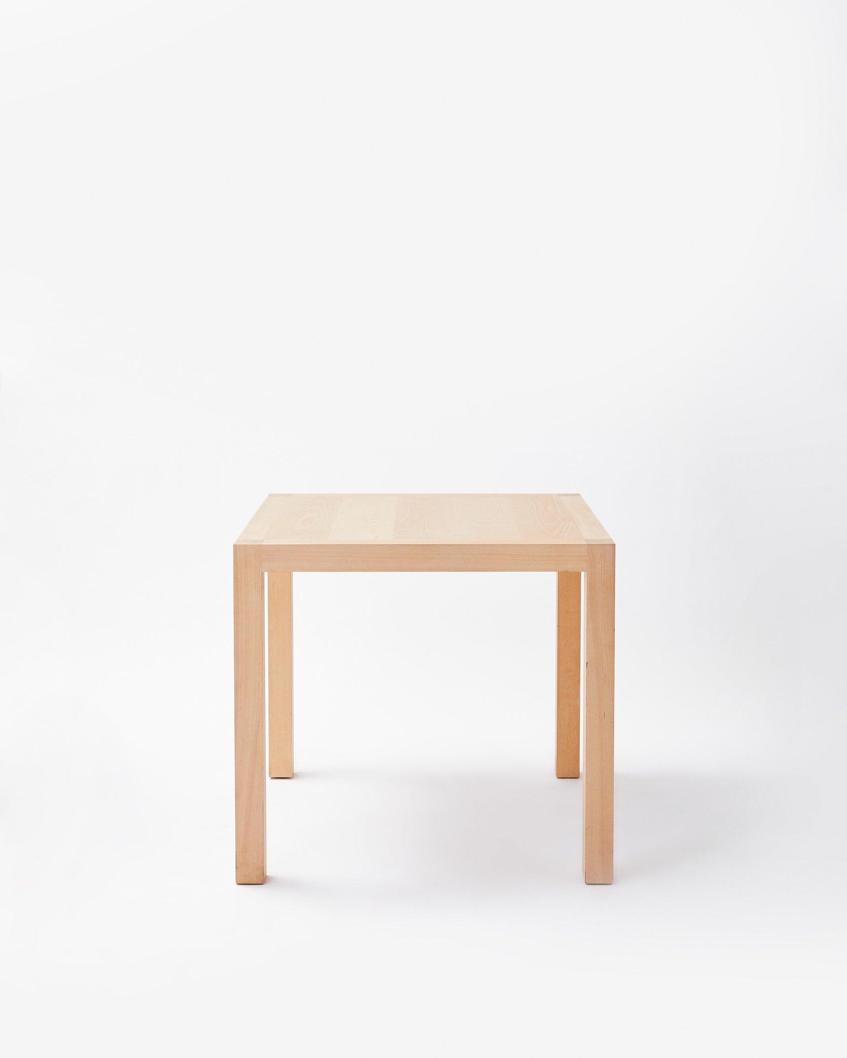 Handmade in denmark table in front view on white background