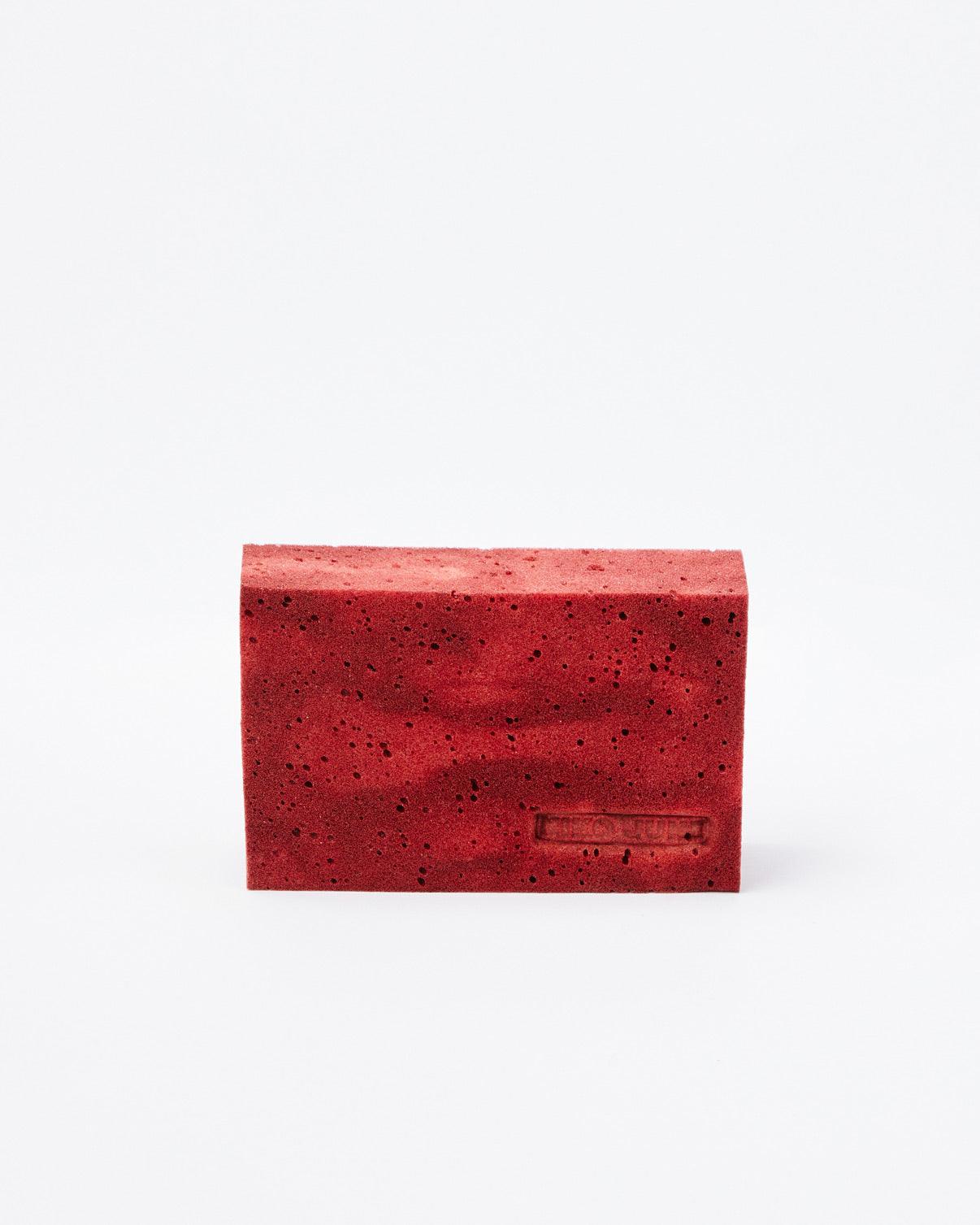 Red brick with NIKO JUNE logo on white background