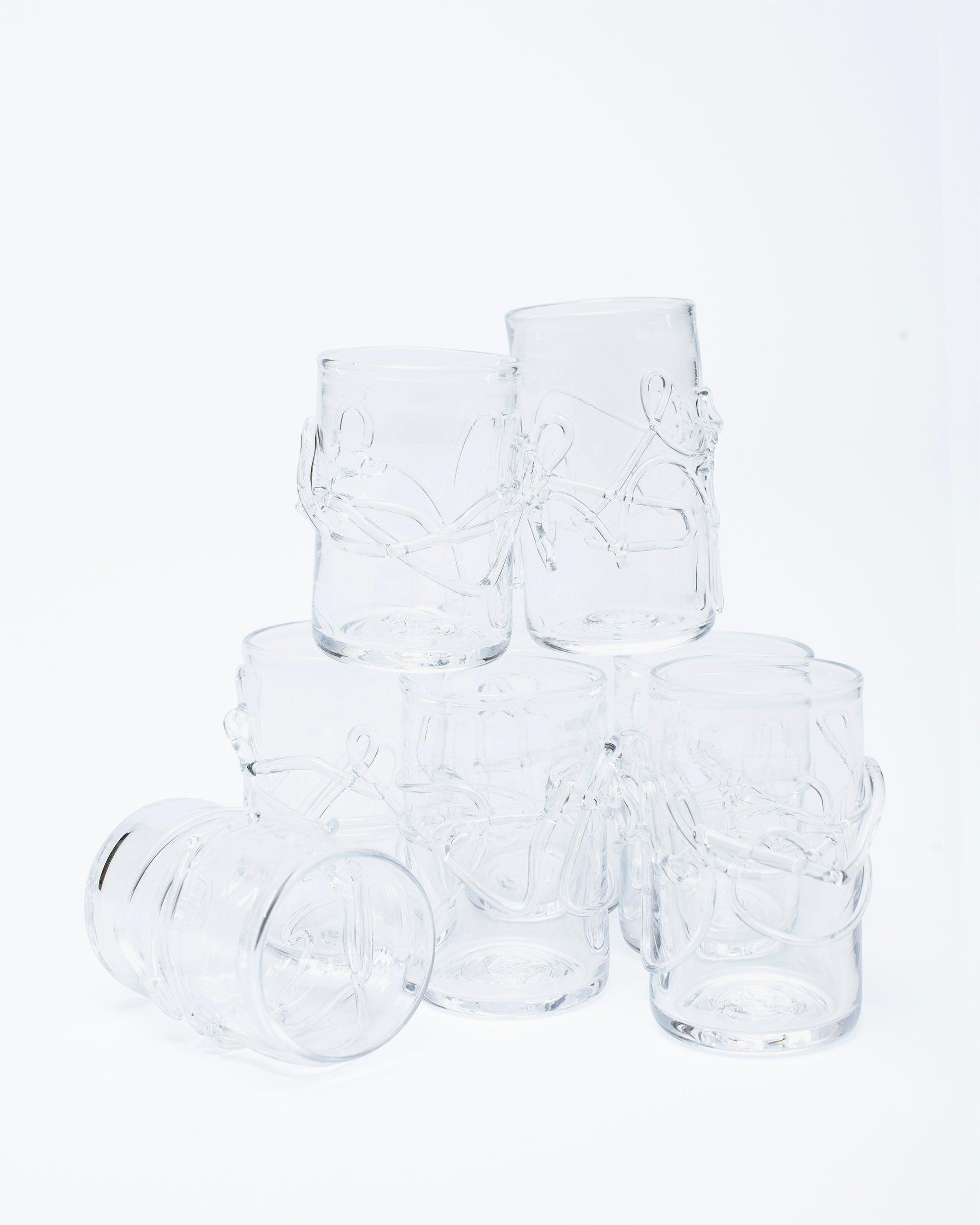 Hand blown glass with water melted glass details with studio light background